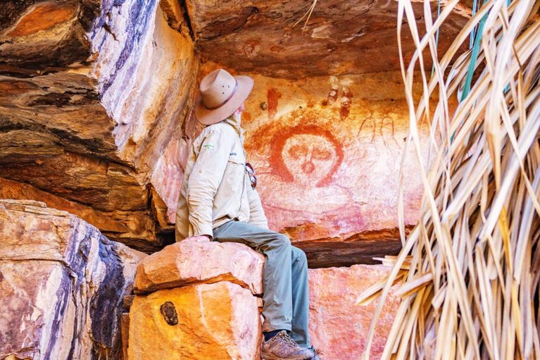 7 Ancient Indigenous rock art is visible at Galvan's Gorge. Phil an Adventure Wild Kimberley Tours guide takes a closer look