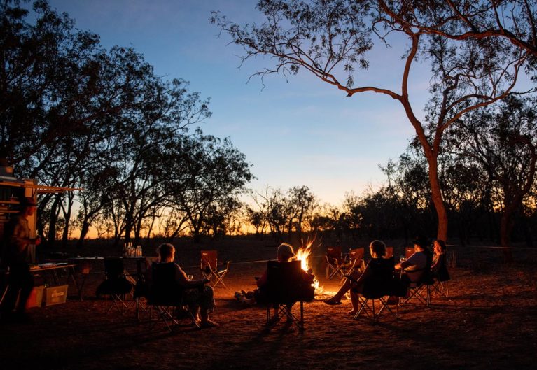 7 Relax around the campfire at our exclusive campsite, Fitzroy Crossing on our final night on tour. Serenaded by the sounds of nature & an amazing sunset - Day 11