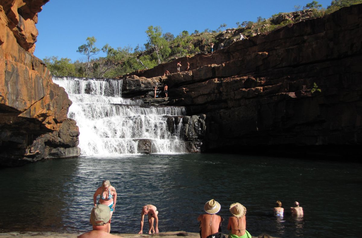 Adventure Wild Kimberley Tours guests swim at Bell Gorge - the volume of water at the falls varies year to year