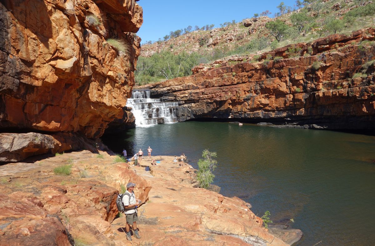 Adventure Wild Kimberley Tours guide, leads the group to the lower pool for a swim beneath the Bell Gorge falls