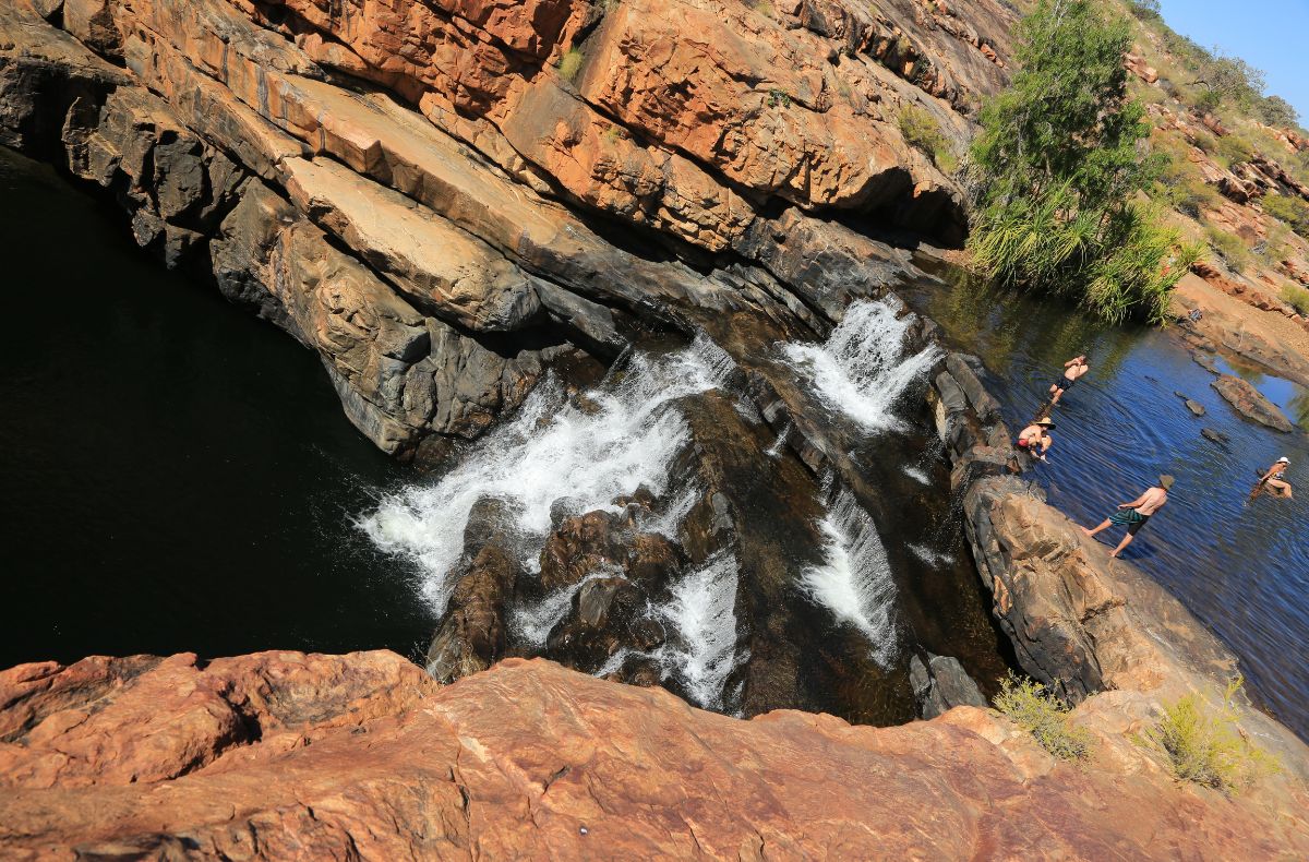 Many guests are happy enjoying the shallow waters at the top of the falls - Bells Gorge