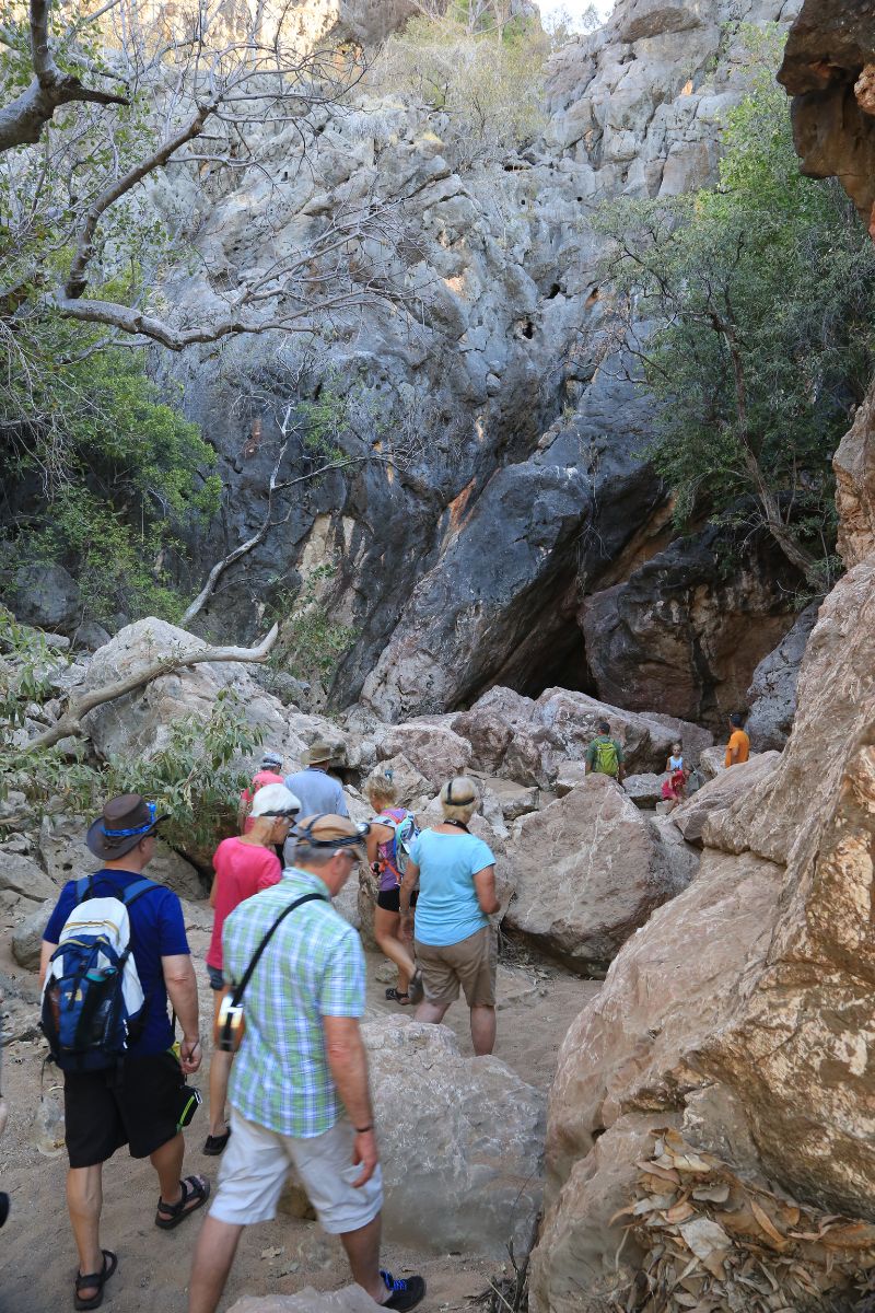 The approach to Tunnel Creek includes navigating natural rock barriers