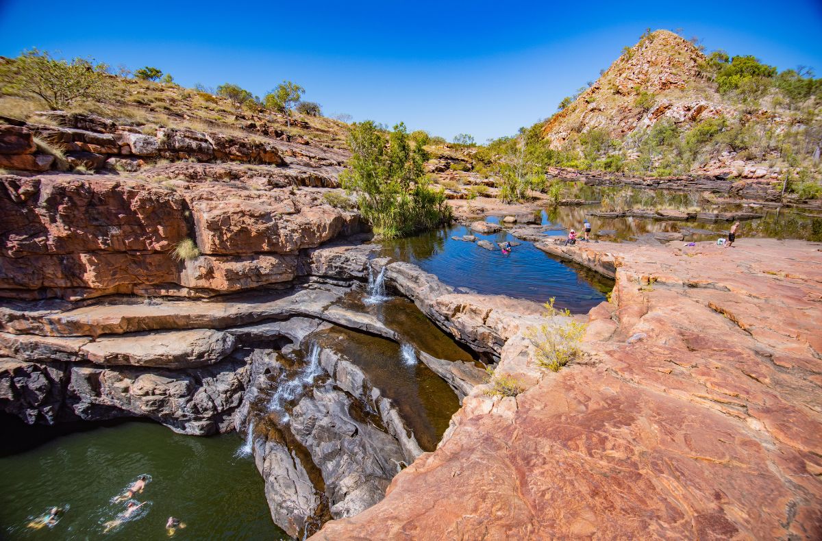 The hike into Bell Gorge offers choices, relaxing in the upper pools or hiking to swim below