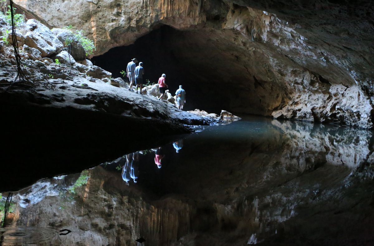 The natural opening midway through the tunnel allows light through the otherwise dark Tunnel Creek