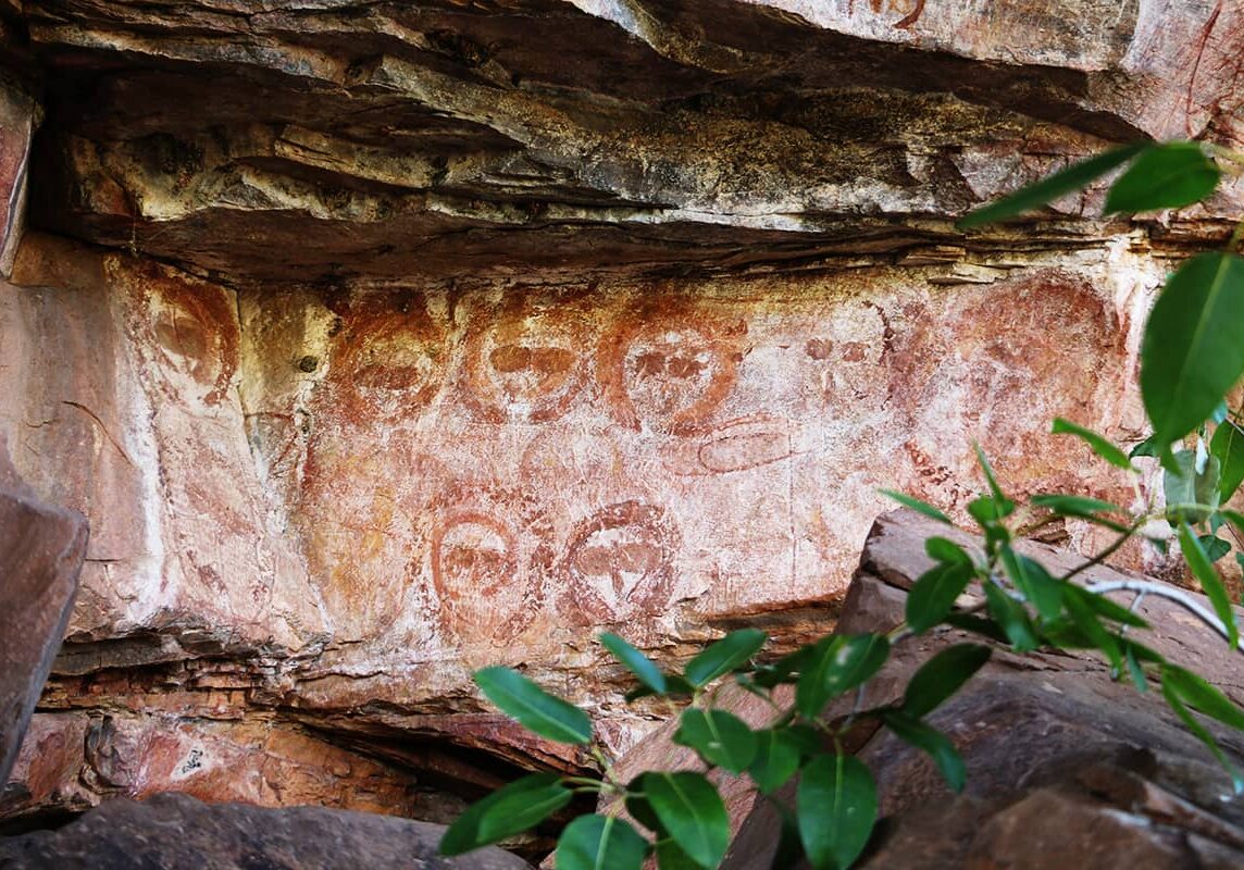Ancient Indigenous rock art preserved by a rock ledge. Wandjina & Gwion art is found throughout the Kimberley region.
