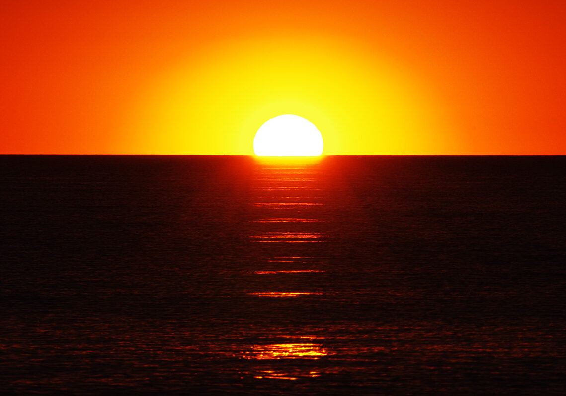 As the sun sets over Cable Beach & the Indian Ocean in Broome it creates a 'staircase to the sun'.