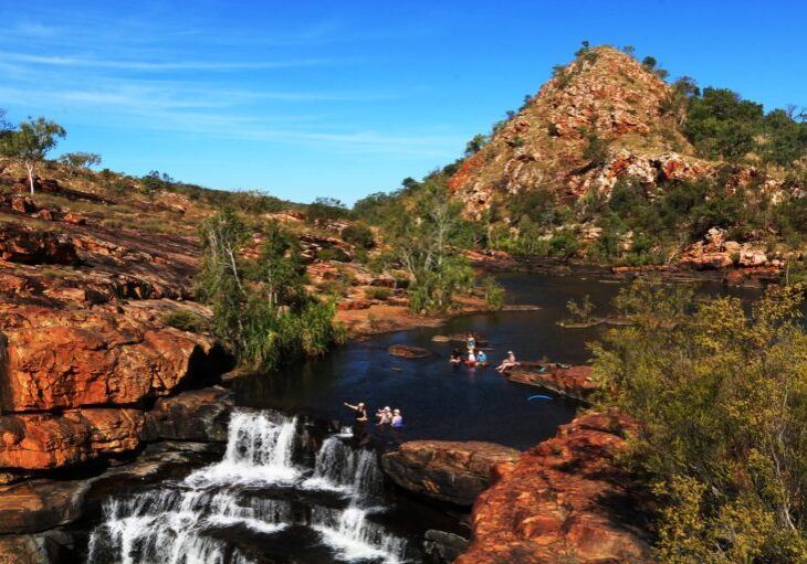 Swimming in the rock pool below waterfalls at Bell Gorge, Gibb River Road, The Kimberley