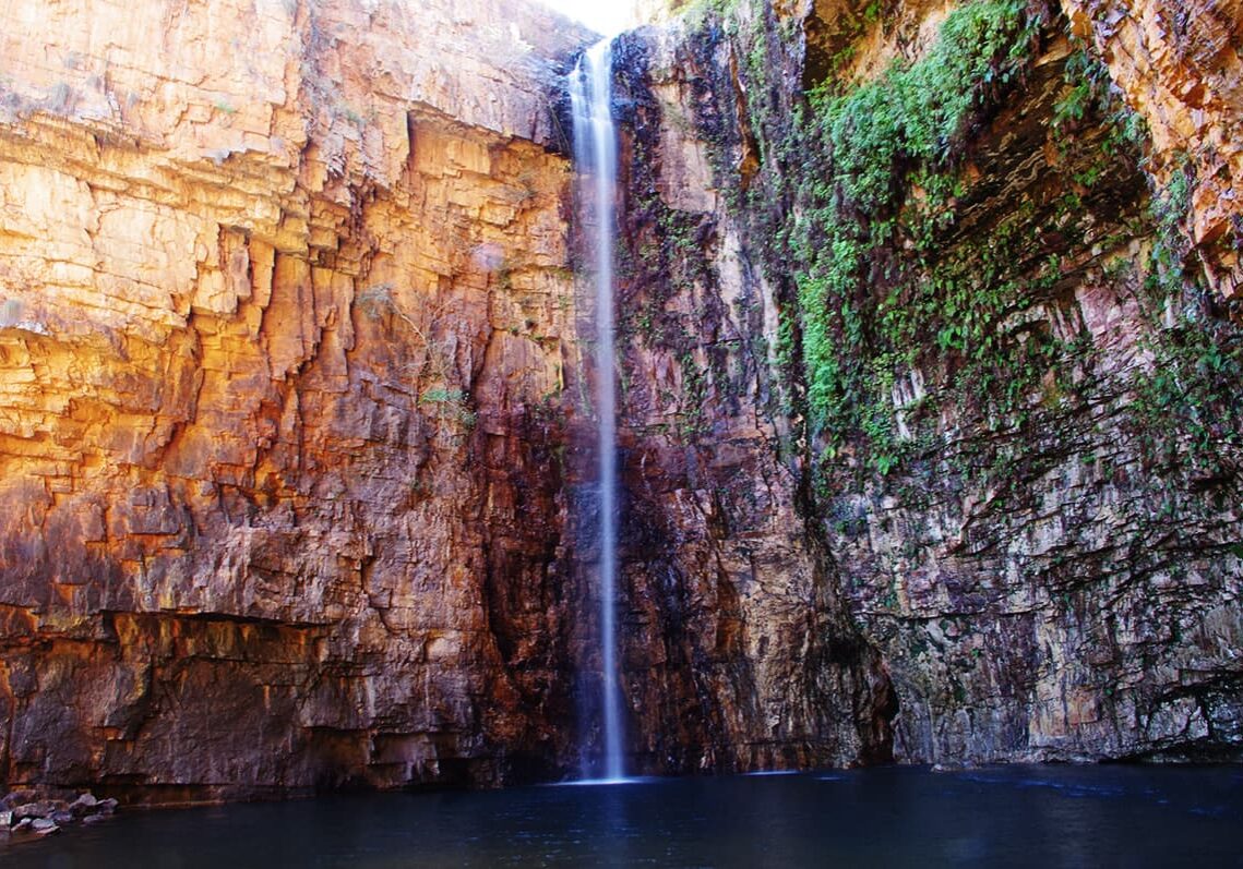Water falls from sheer cliffs 65m high into a refreshing pool. Thermal waters trickle from rocks to the right of Emma Gorge